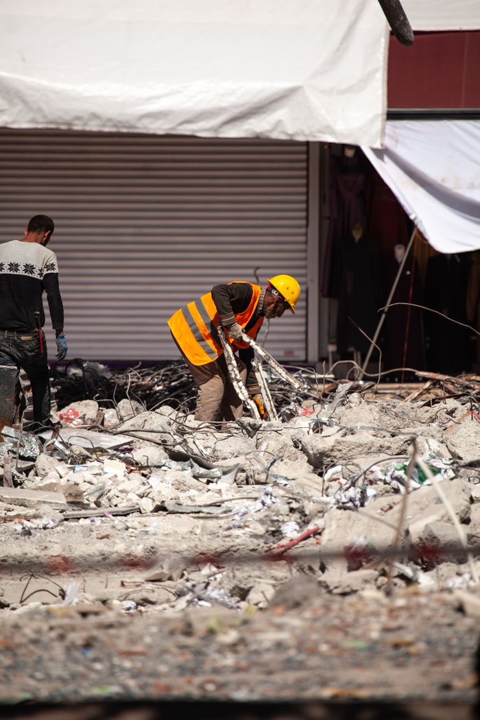Mastering the First Impression: Your intriguing post title goes here Workers in reflective vests clear debris from earthquake damage in Malatya, Türkiye.